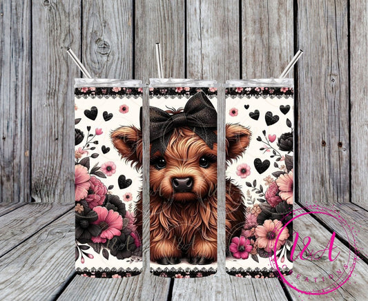 Highland cow with black bow