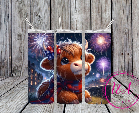 Highland cow with red and blue bow